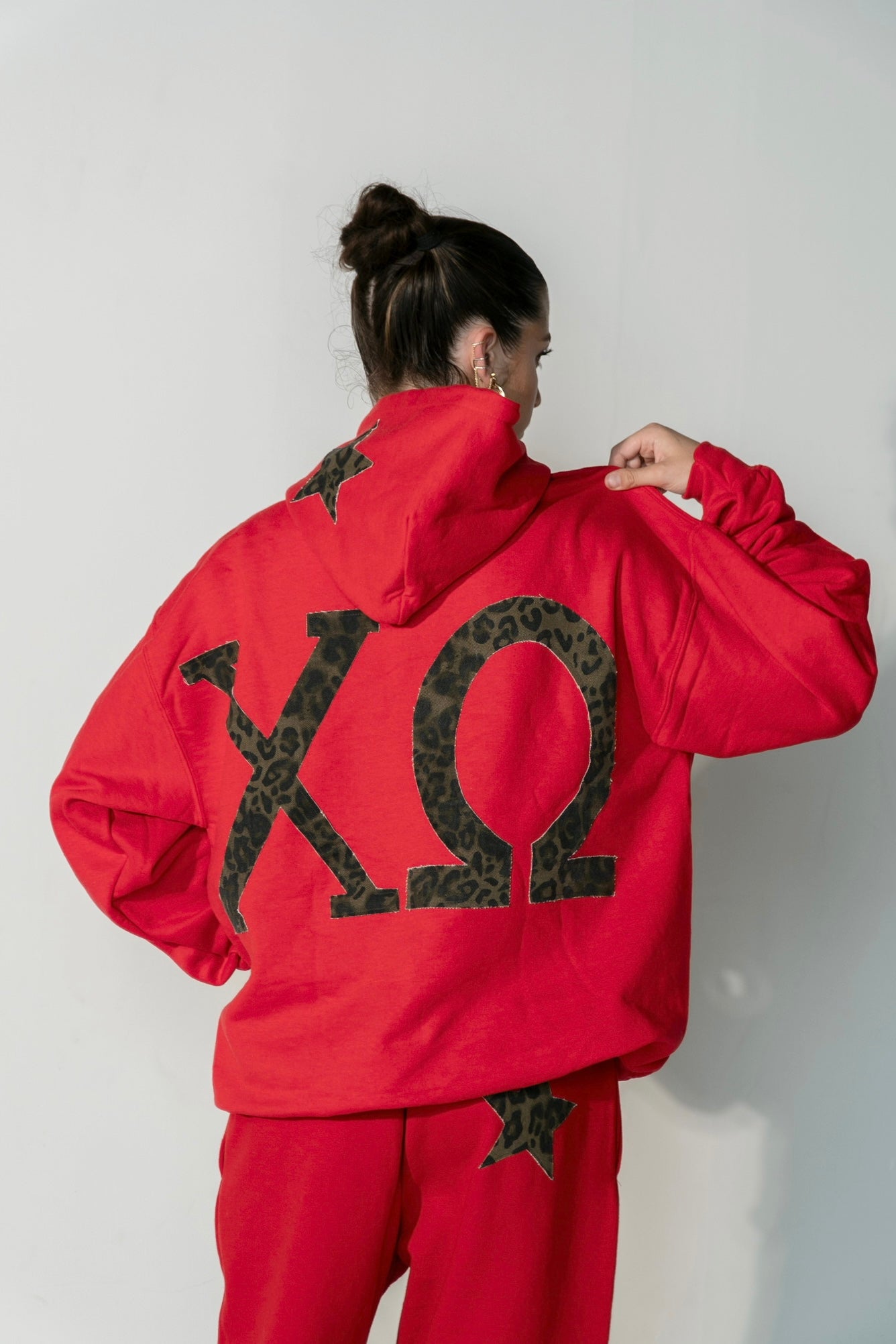 Chi Omega Cheetah on Red Sweatpants